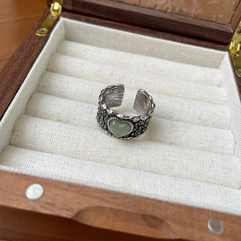 Adjustable opening heart ring in retro wide-faced moonlight style with white copper plated silver construction