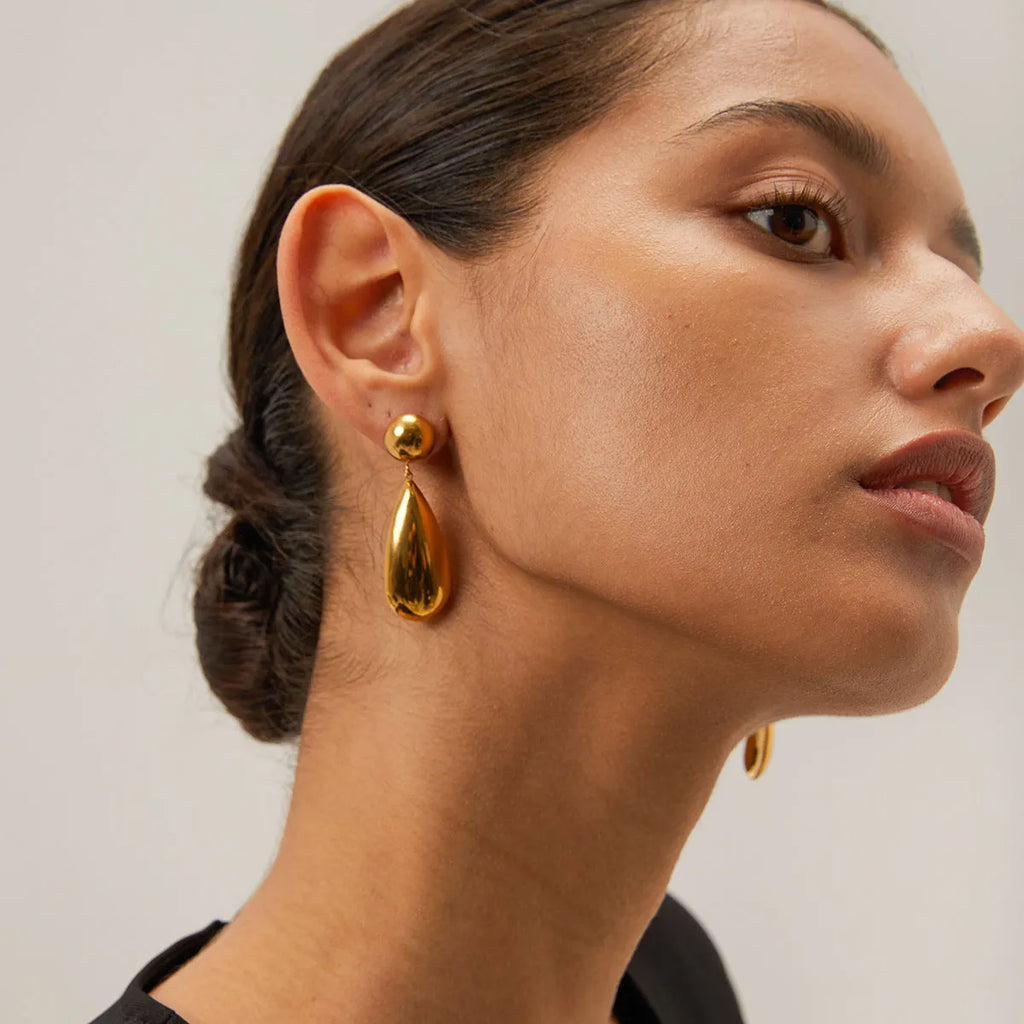 Gold geometric water drop earrings with hemisphere pendant design on stainless steel