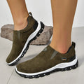 Men's thin grey overshoe cover with round toe and rubber sole, shown on a shoe.