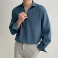 Men's loose lapel casual long sleeve shirt in solid colour on a hanger