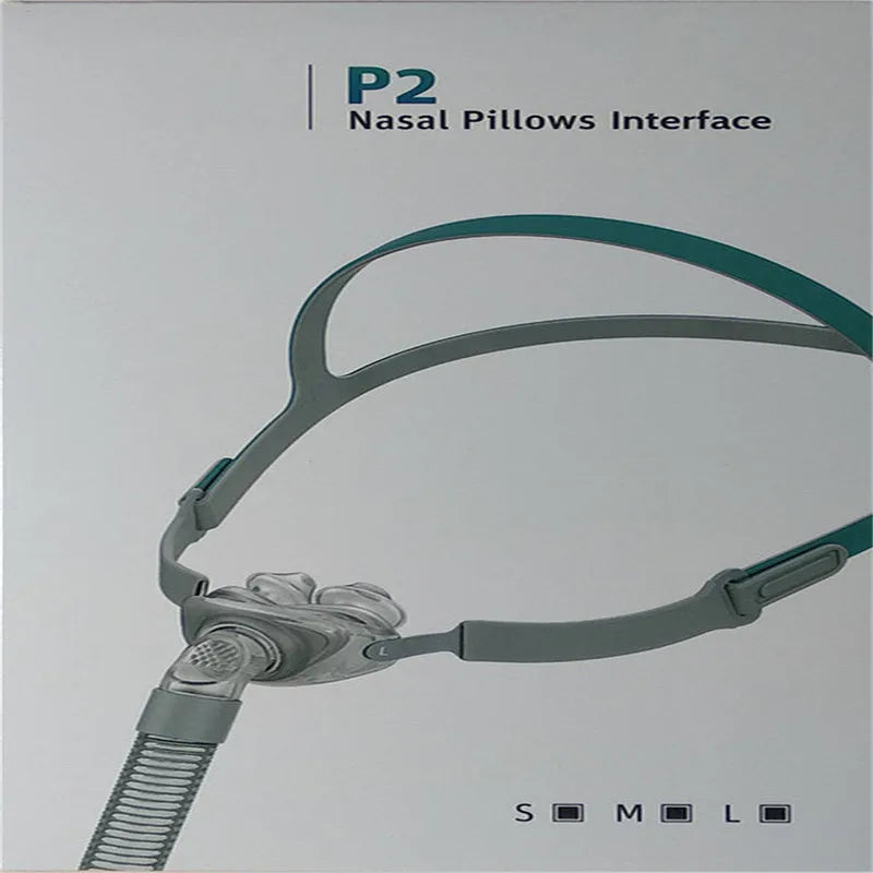 Ventilator nasal pillow mask with silicone cushion and headband components displayed in English packaging
