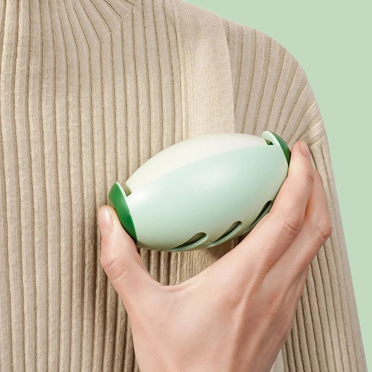 Green washable gel lint roller ball for removing pet hair from fabrics