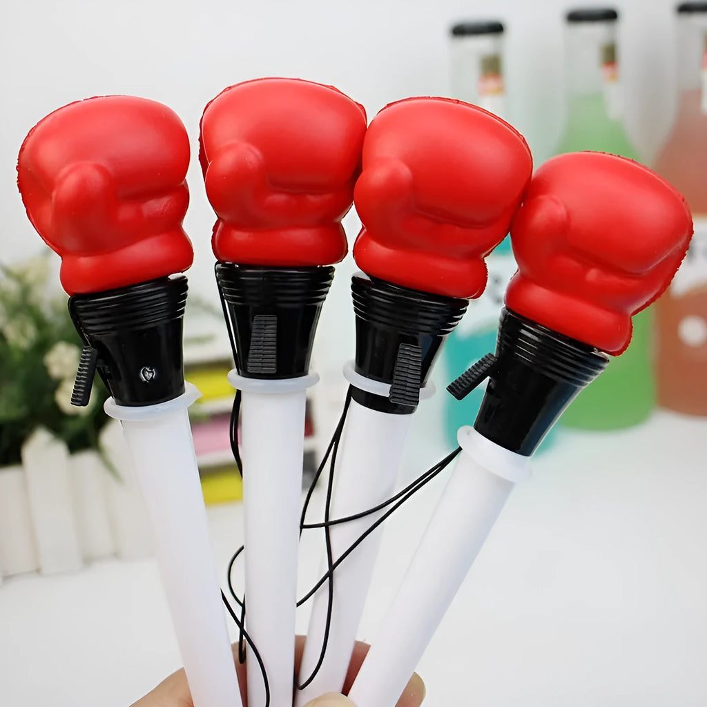 Set of four black and silver boxing press ejection pens with 0.7mm bullet tips displayed on a white surface.