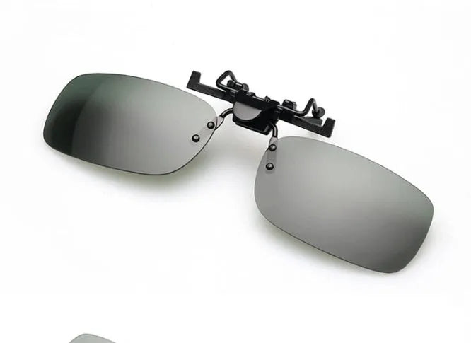 A clip-on sunglasses attachment for prescription glasses, shown in large and small sizes with grey, dark green, and night vision tinted PC lenses.