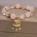 Khaki coloured crystal bead bracelet for women on a gold silk cord, showing Japanese and South Korean style.