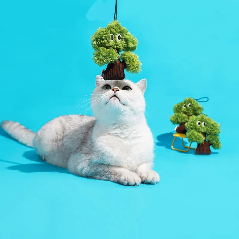 Pine tree shaped cat chew toy pendant that doubles as a tease stick.