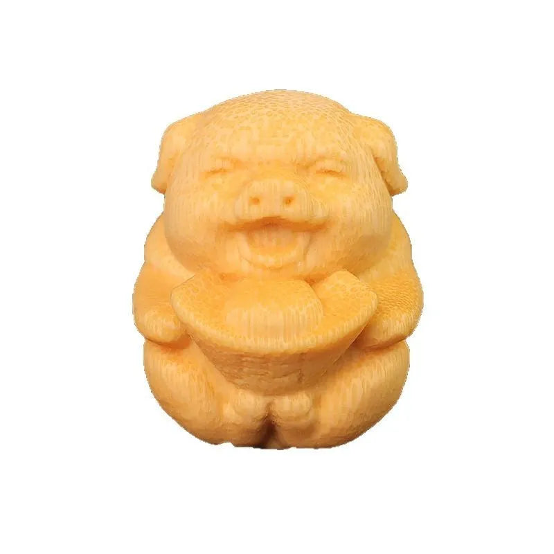 Solid bamboo carving pig ornament measuring 4cm height by 3.5cm diameter