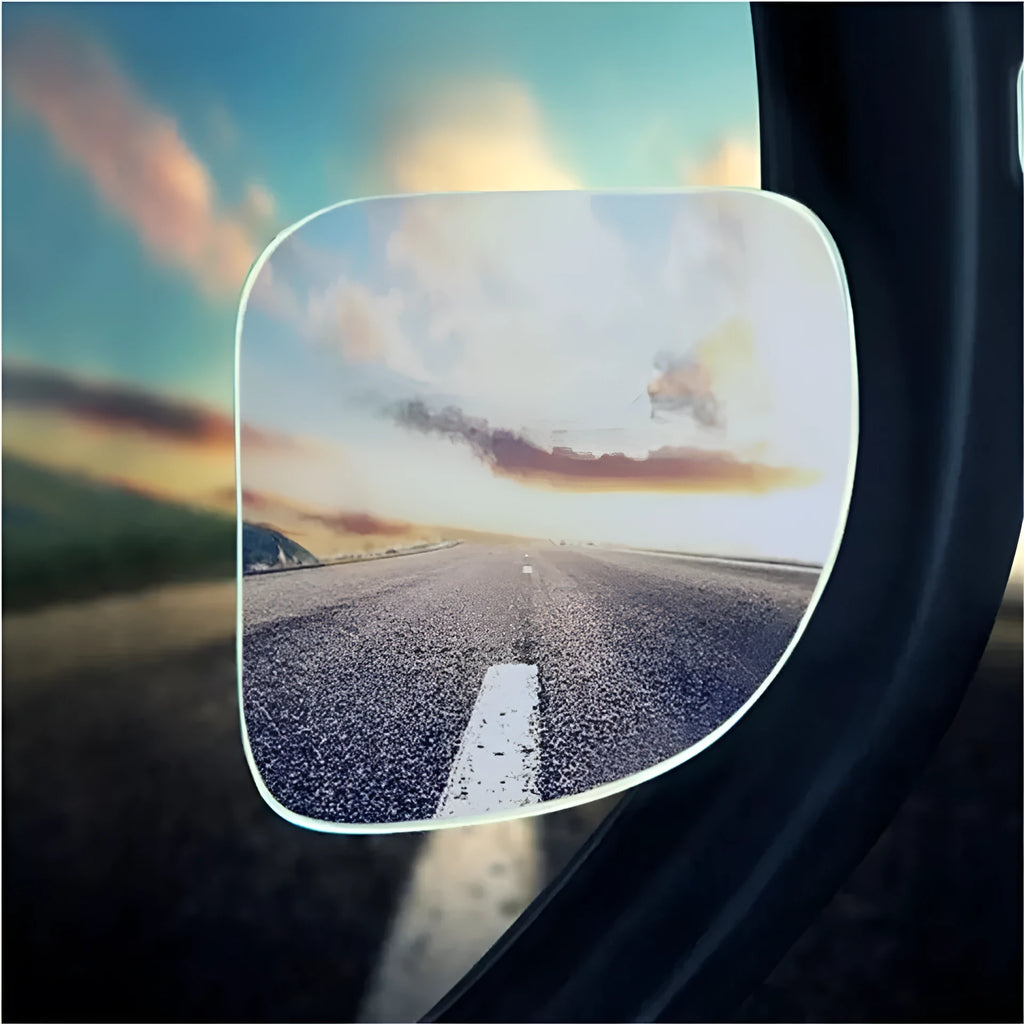 White fan-shaped car blind spot mirror with 360-degree adjustable mount on a universal bracket.
