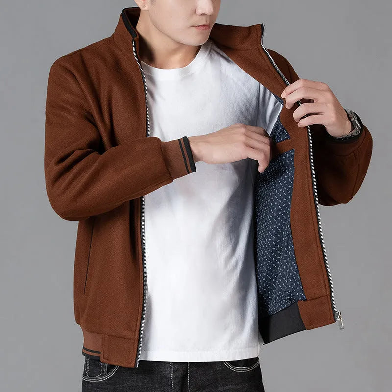 Men's grey sport-style fleece jacket with long sleeves on a hanger