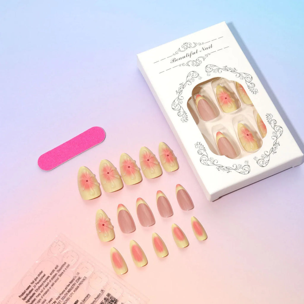 Plastic false nails with white cartoon 3D flower decoration, pot of jelly glue, and nail file on pink background.