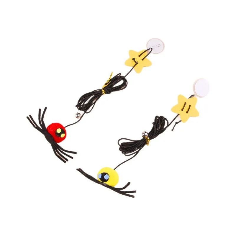 Red cat hanging door toy with elastic rope, feather, bell, and spider decoration