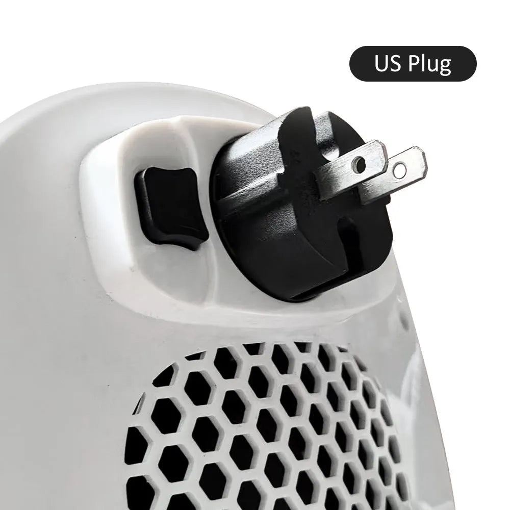 White portable ceramic electric fan heater with remote control on a table.