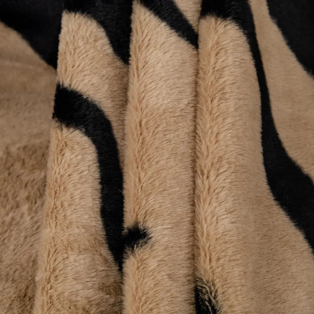 Zebra pattern flannel sofa slipcover in caramel colour, shown on a grey sofa