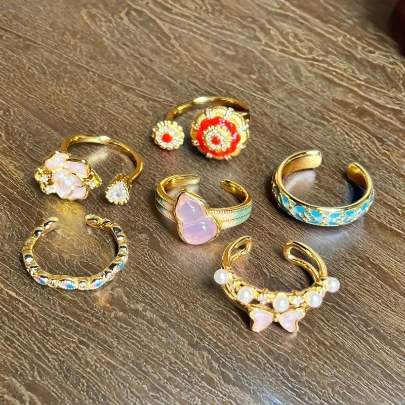 Adjustable copper ring with gourd motif, flower and bow shapes, zircon stones in six colour options