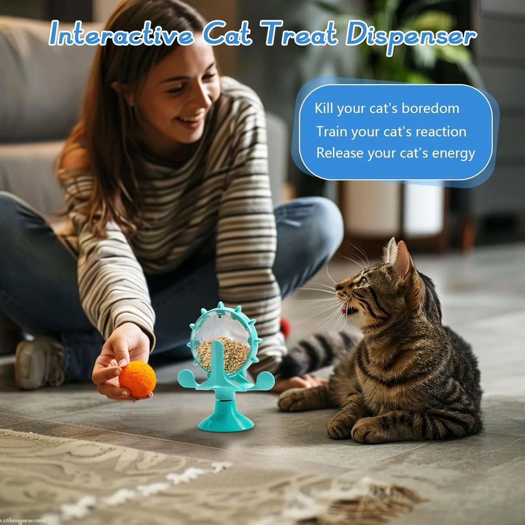 Blue interactive pet puzzle feeder toy with rotating spinner and sucker base for cats and dogs