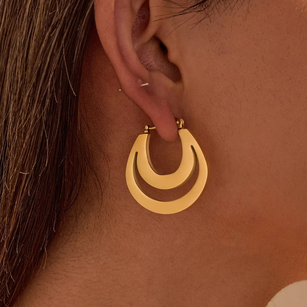 Geometric French earrings with circular ring design in gold and steel metallic finishes