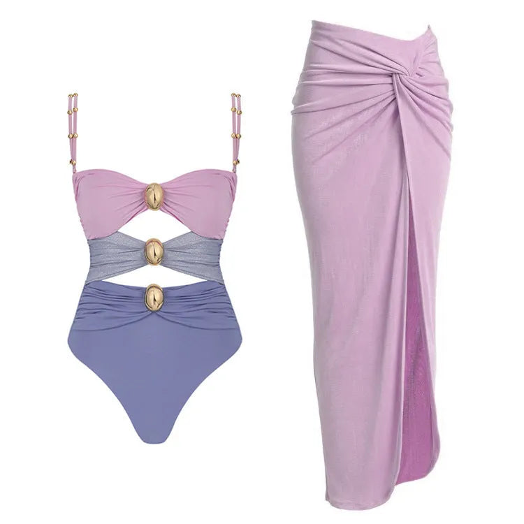 Women's solid colour one-piece swimsuit with detachable skirt and gold button detail
