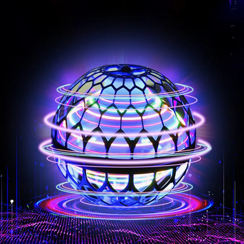 Soft blue spinning flying ball toy with LED lights hovering above a child's hand next to a magic wand.