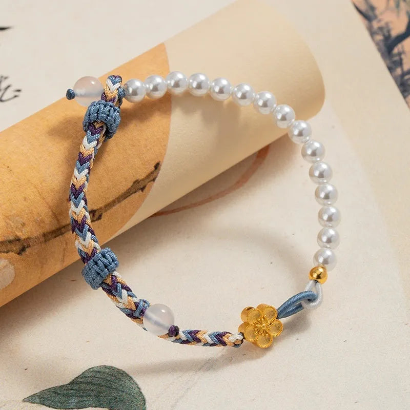Peach-coloured Chinese flower weaving carrying strap with sterling silver electroplating and pearl details