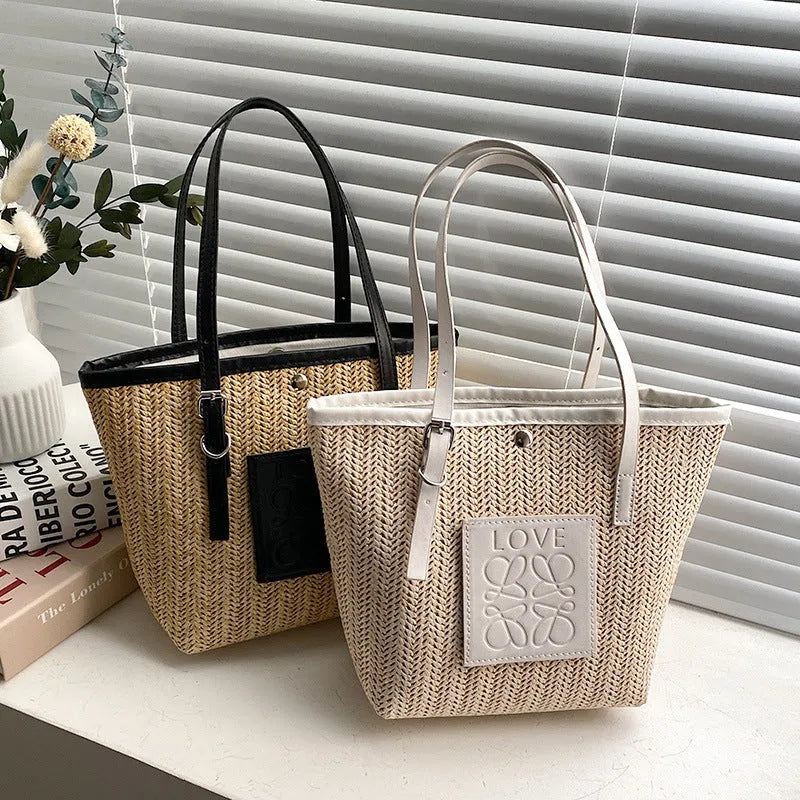 Straw woven women's shoulder bag with 27cm width showing three-dimensional pocket and 18cm handle