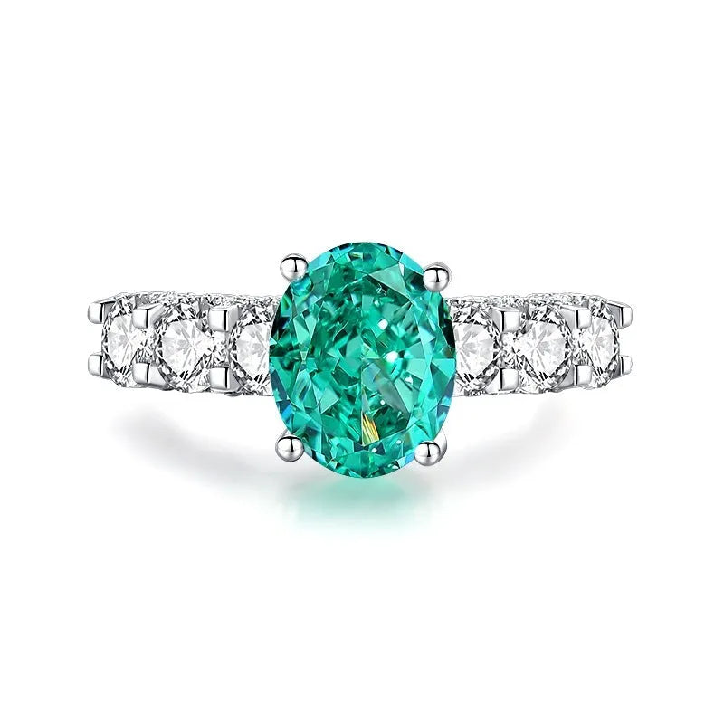 S925 sterling silver emerald ring with inlaid high carbon diamonds in a geometric Palaibahao design on a model's finger.