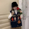Sleeveless loose diamond plaid cardigan top in khaki colour on a hanger.