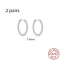 Twisted sterling silver round ring earrings in gold and white gold finishes showing multiple sizes