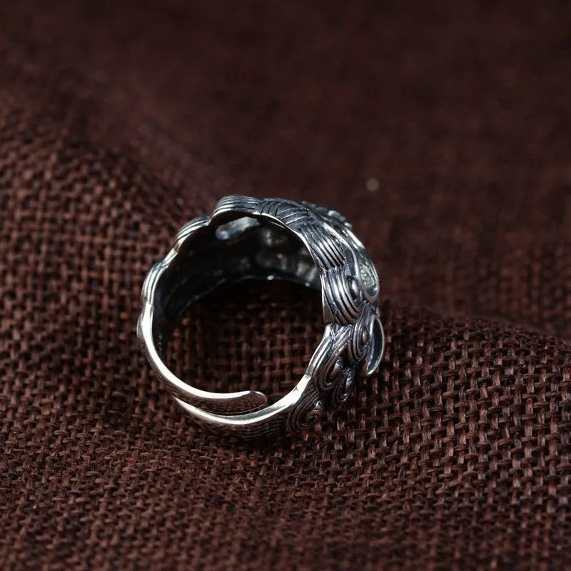Personalised silver open ring with a diamond-patterned jibeast or animal zodiac design.