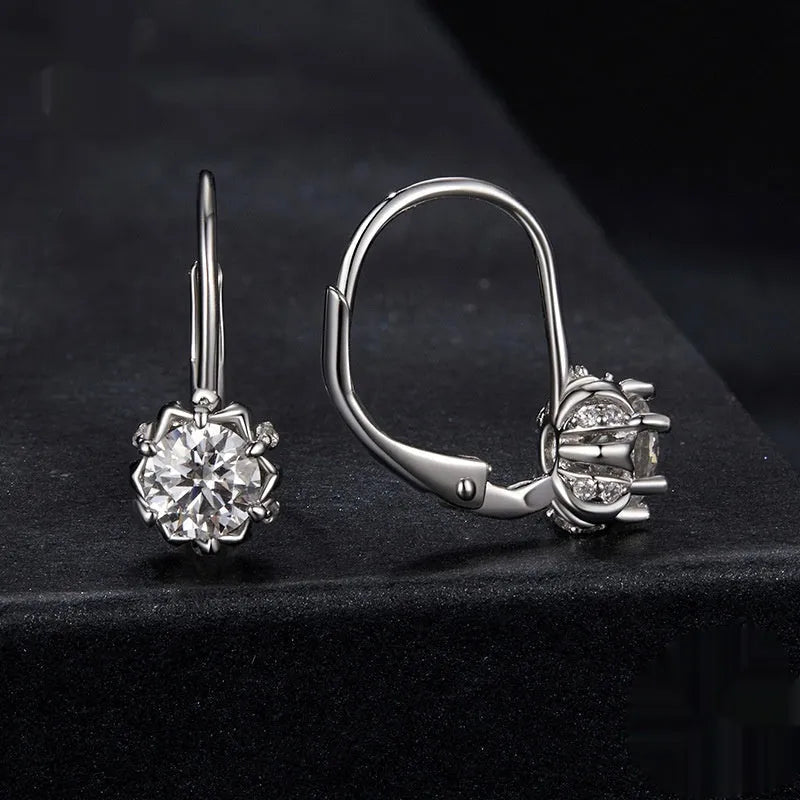 Sterling silver flower bud ear clips with white gold plating and moissanite stone
