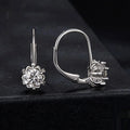 Sterling silver flower bud ear clips with white gold plating and moissanite stone