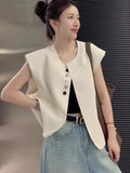Women's loose fit polyester vest in milky white colour with front pocket