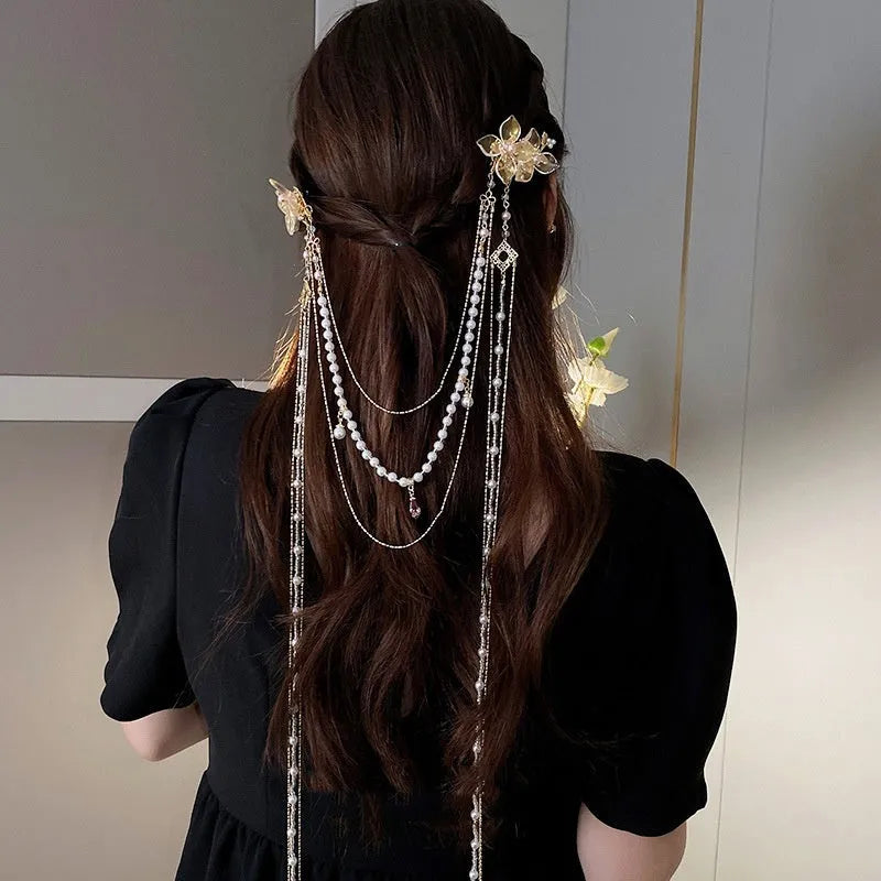 Gold women's hairpin with pearl, diamond flower and long tassel design