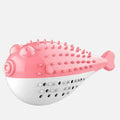 Blue silicone fish-shaped cat chew toy with a protruding grabbing handle on a white background.