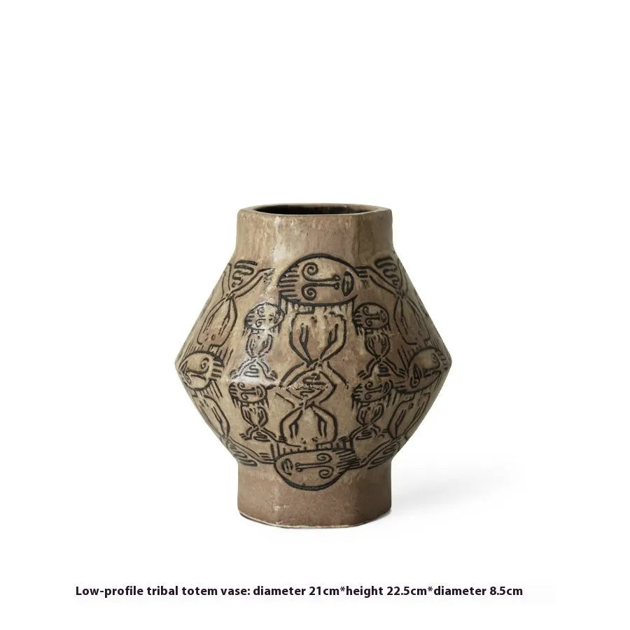 Ceramic vase with hand-painted vintage carved tribal totem art in religious symbolic patterns