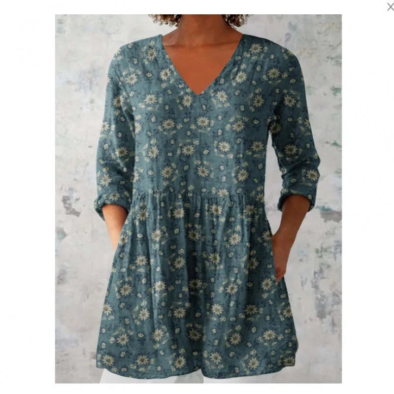 Women's floral printed loose dress with wide waist and three-quarter sleeves on a hanger.