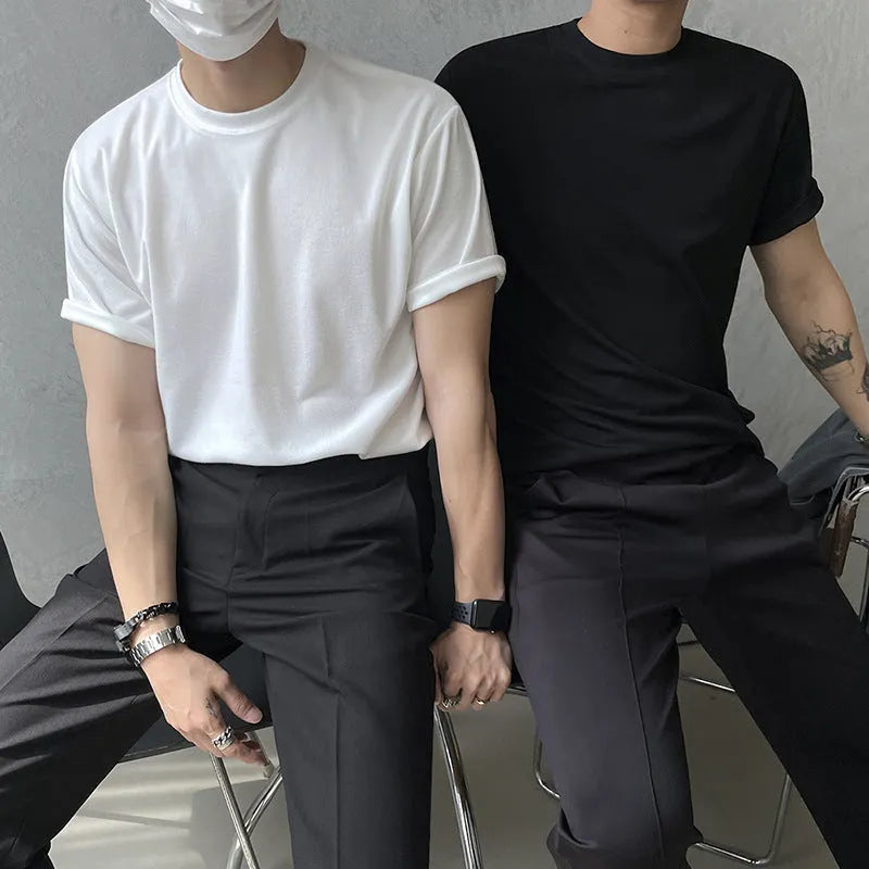 Men's slim-fit cotton T-shirt in solid white colour with half-length sleeves on a hanger.