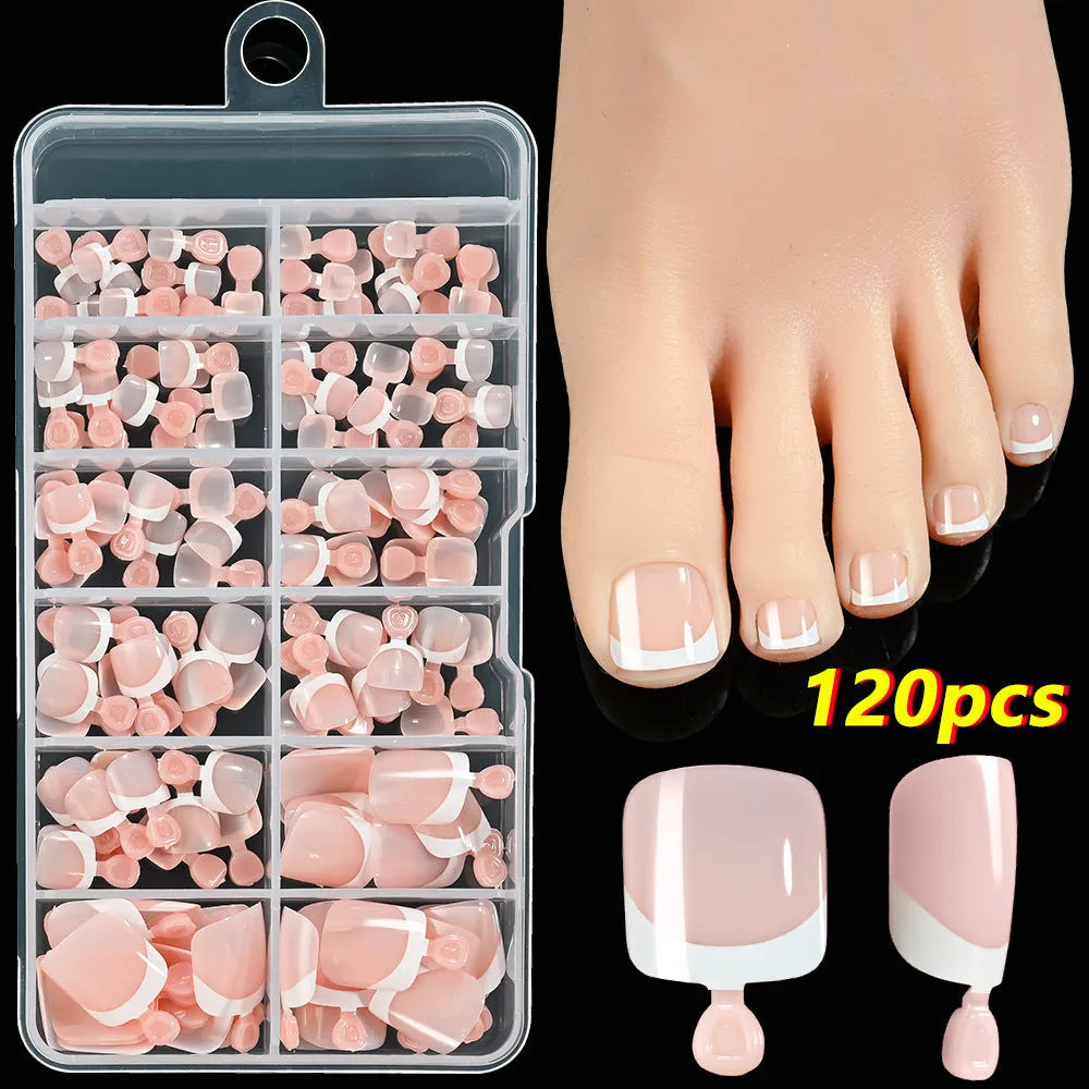 Open box showing 120 French style toe nail pieces with white tips in various nude colours.