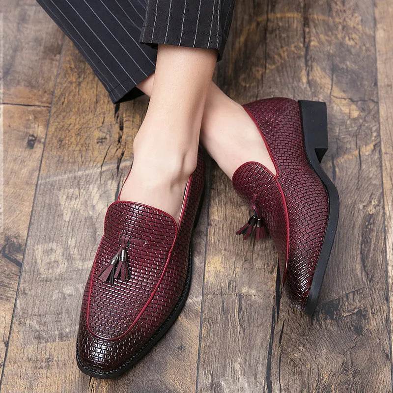 Men's black pointed slip-on shoe with a tassel on a business-style artificial PU upper.