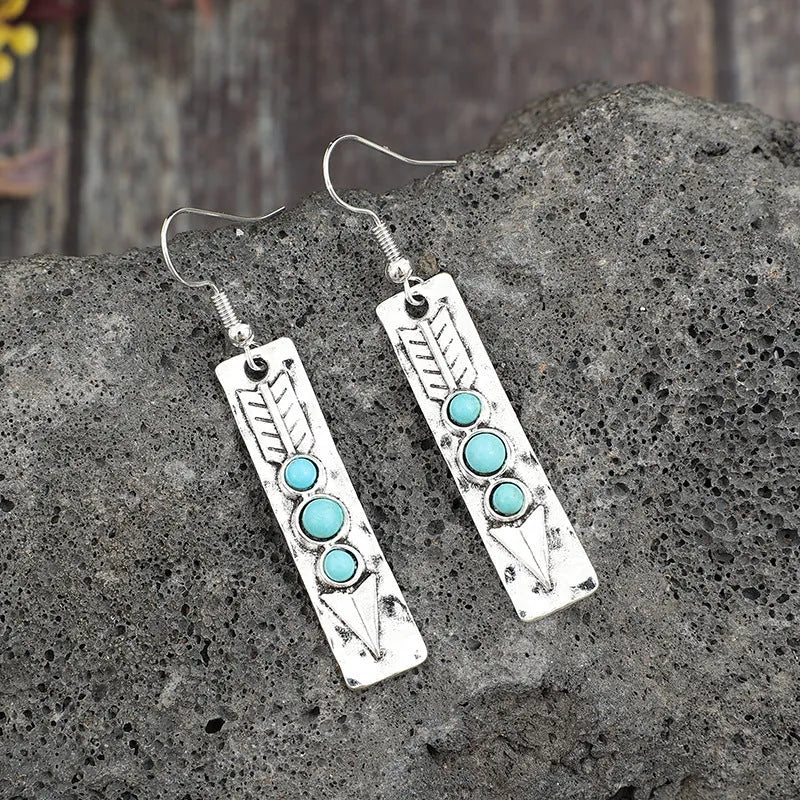 Silver geometric earrings with turquoise inlay in long strip retro design