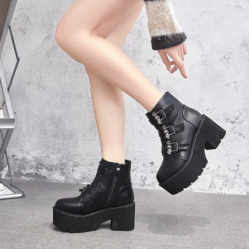 Black women's punk style Martin boots with bat buckle and side zip closure