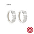 Small round geometric sterling silver stud earrings with diamond-cut detail in gold or silver electroplated finishes