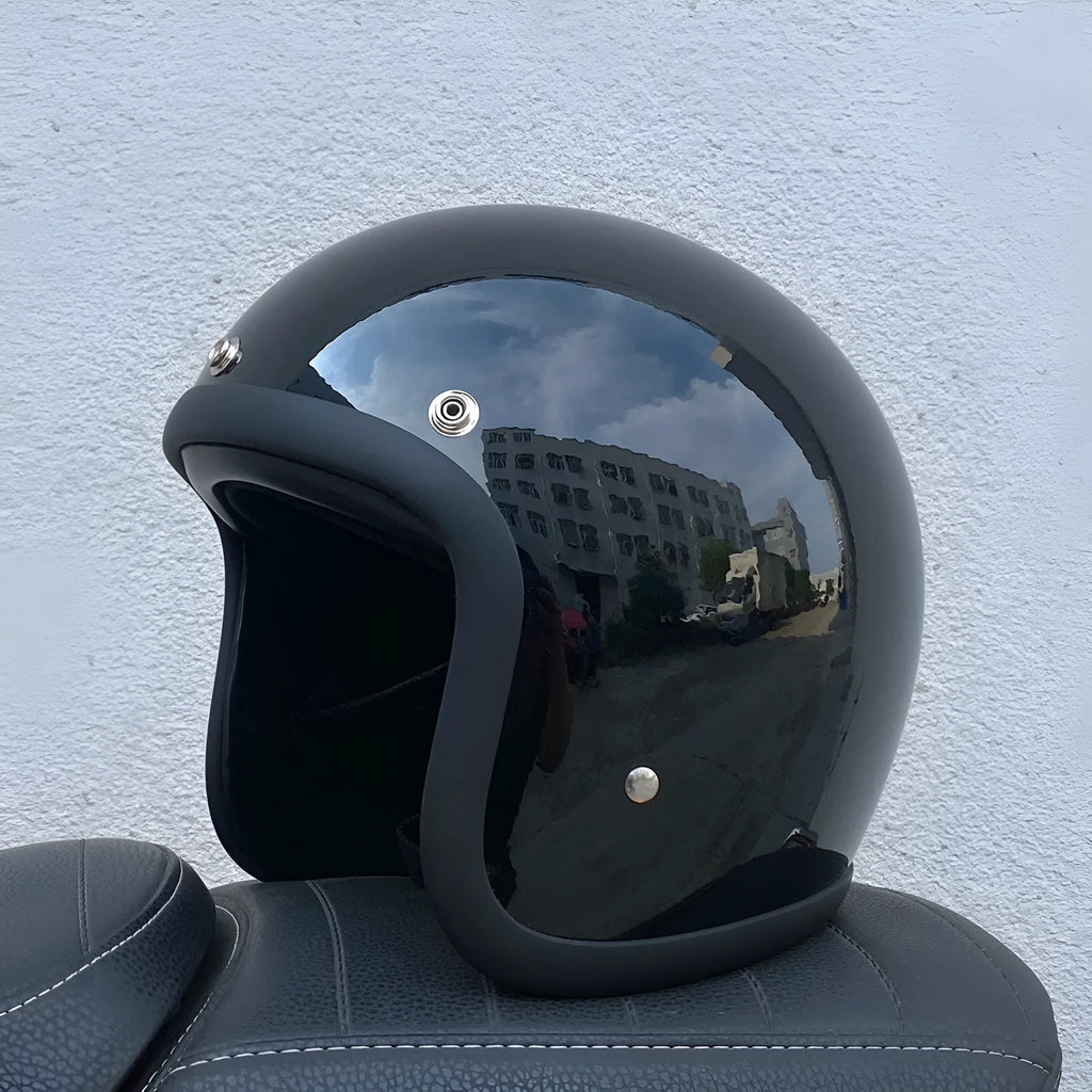 Glass fibre motorcycle half helmet shown in a retro style on a stand.