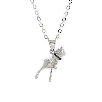 Close-up of a sterling silver cat pendant on a clavicle necklace chain.