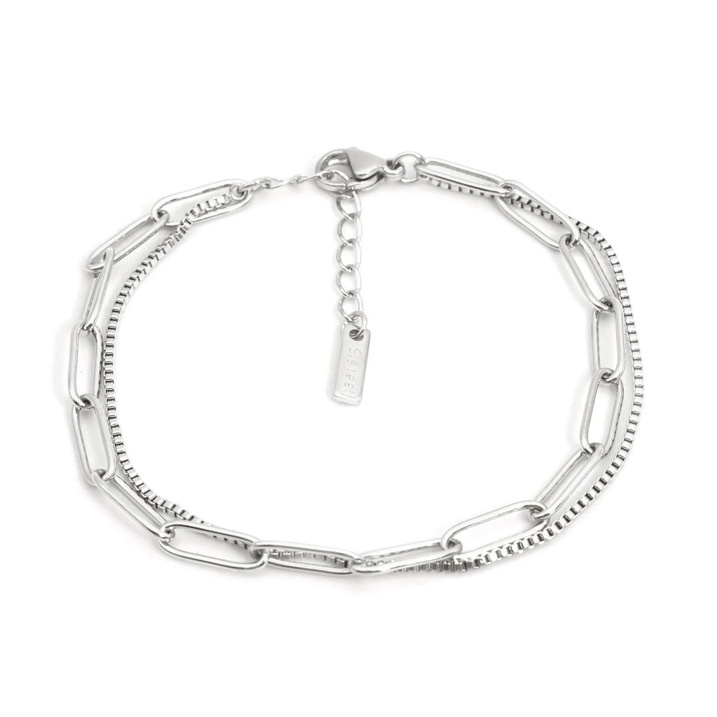 Double-layer titanium steel women's bracelet with geometric shape and linear design elements in gold or silver finish