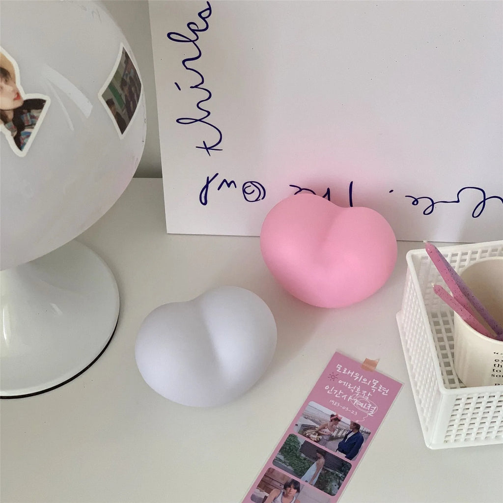 Vinyl atmosphere lamp emitting warm glow light, available in pink or white colours with battery operation