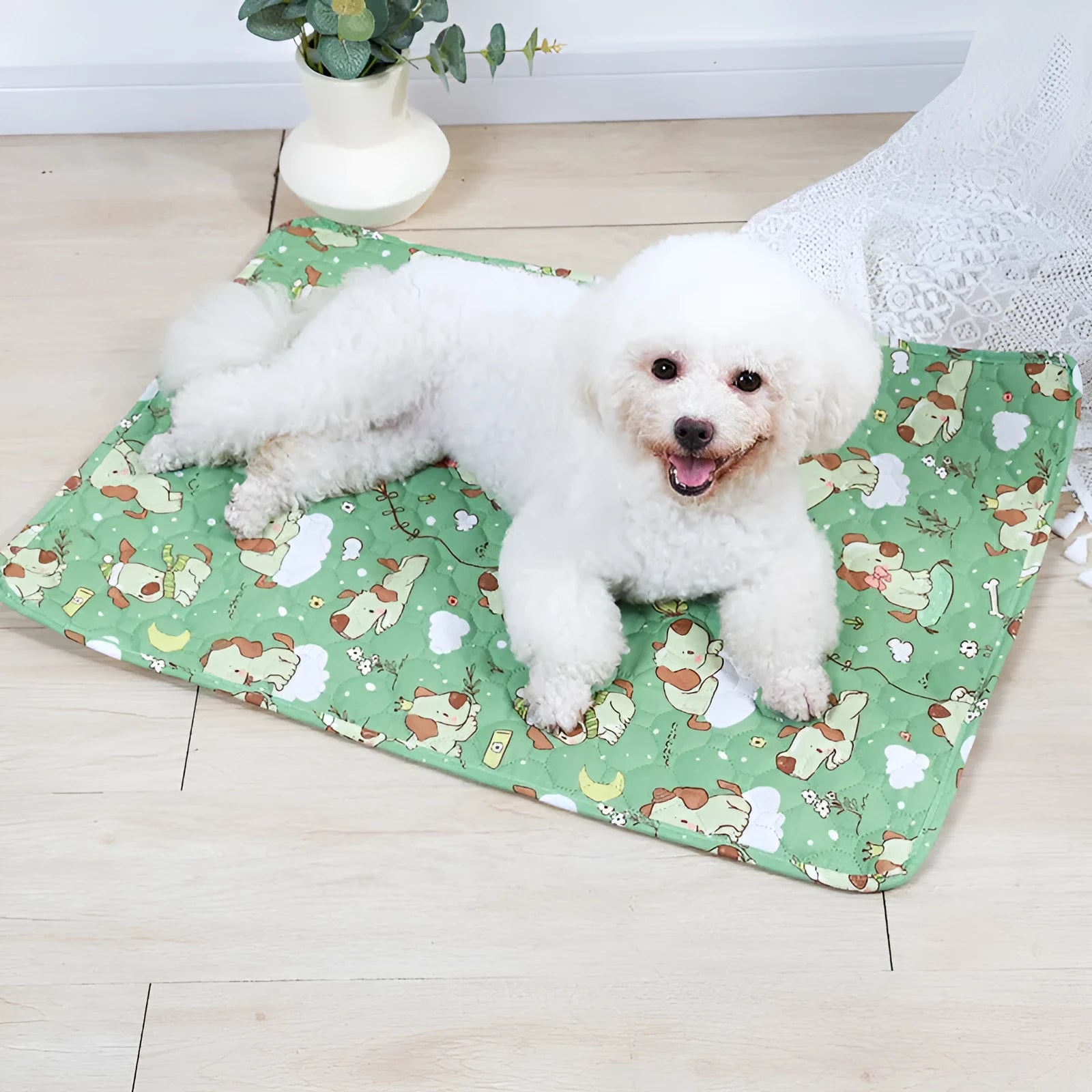 Reusable washable pet urine pad with colourful animal print design on cloth with waterproof base.