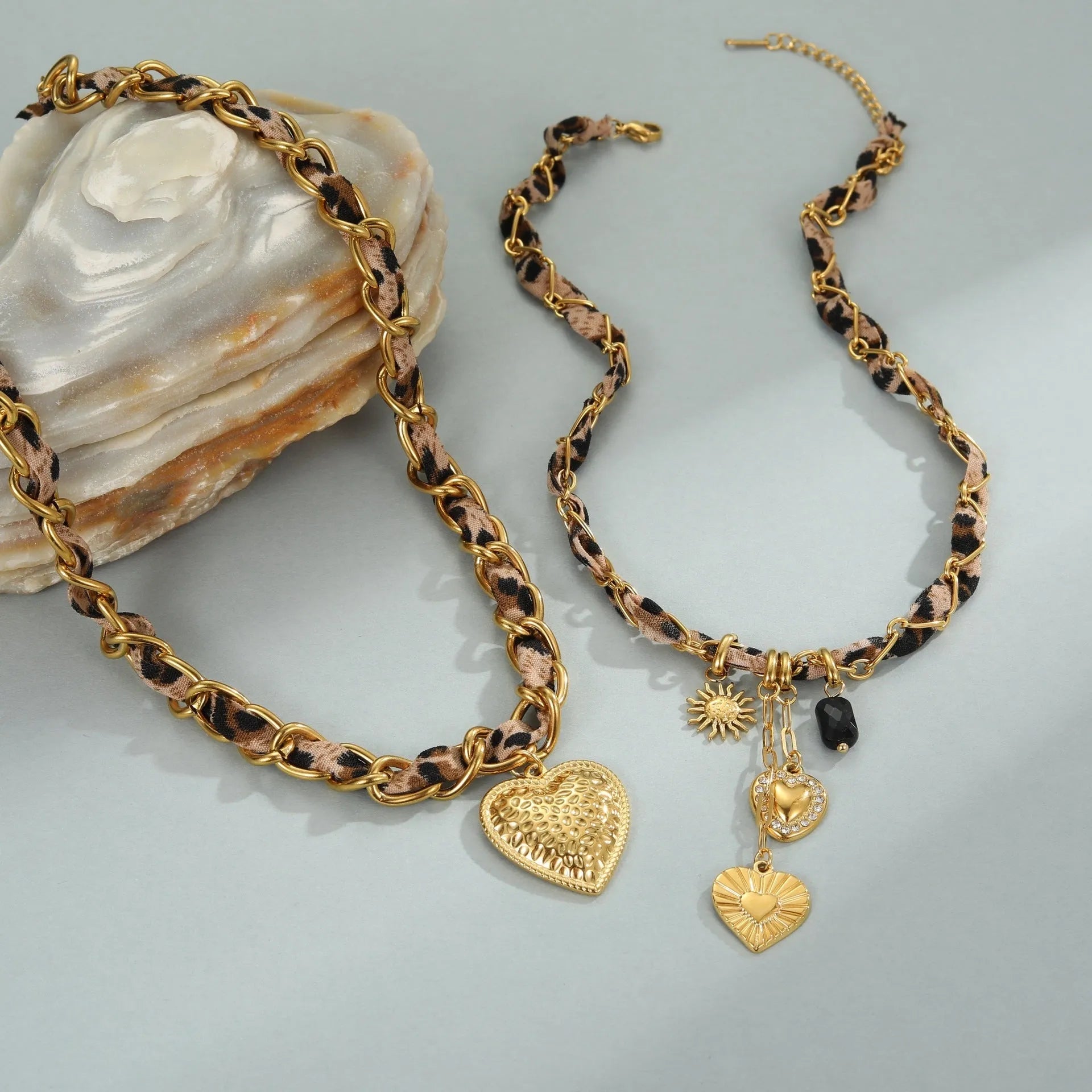 Stainless steel geometric leopard love pendant necklace with electroplated 18K finish on adjustable chain