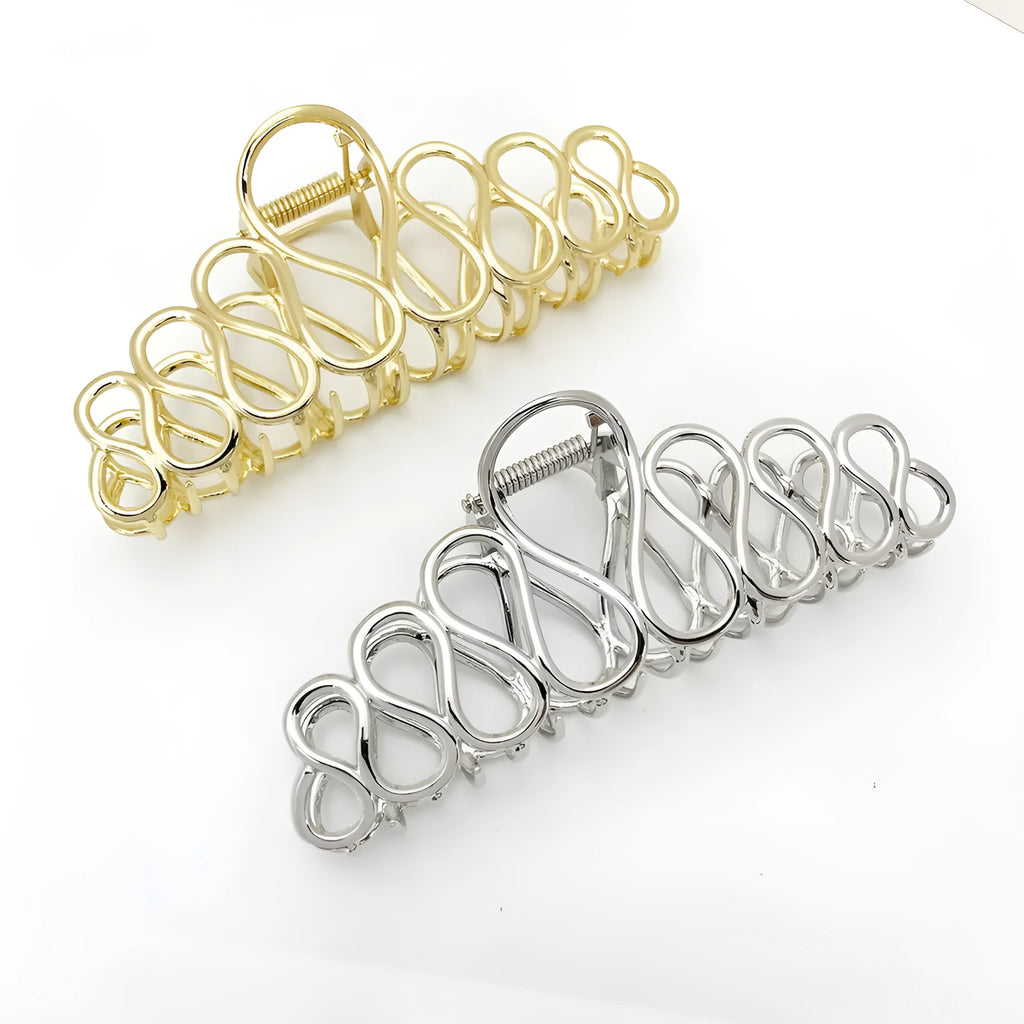 Large gold and silver alloy hair clip with a minimalist design and tassel detail for updo hairstyles.
