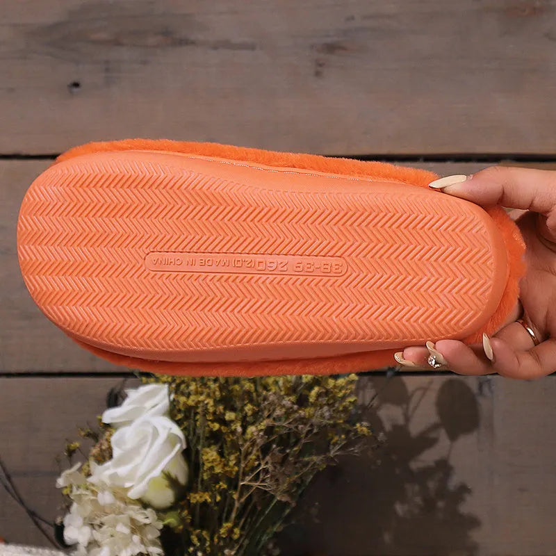 Orange Halloween pumpkin slippers with plush lining and non-slip PVC soles