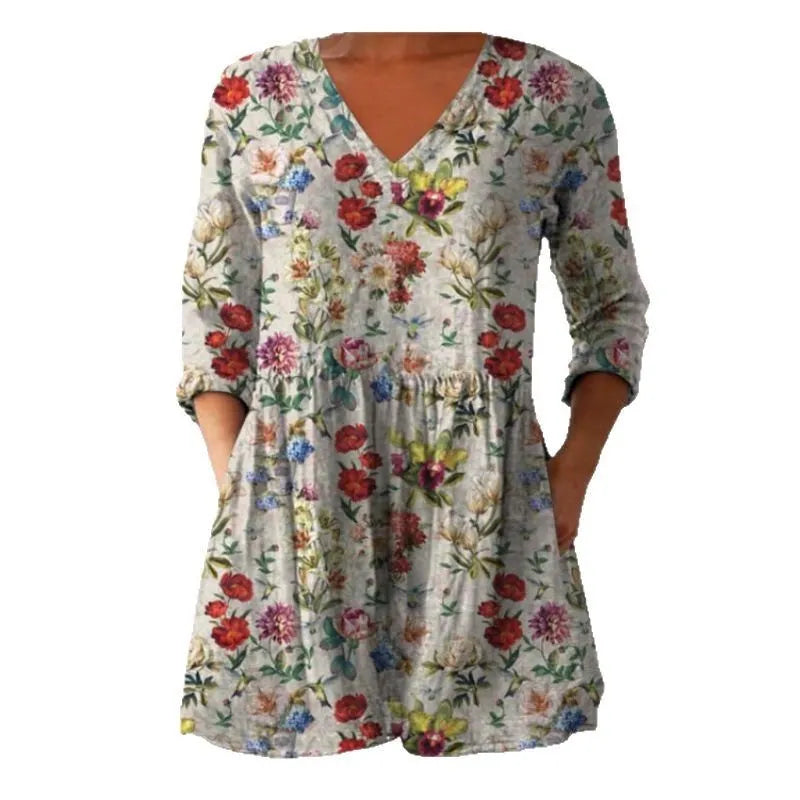 Women's floral printed loose dress with wide waist and three-quarter sleeves on a hanger.
